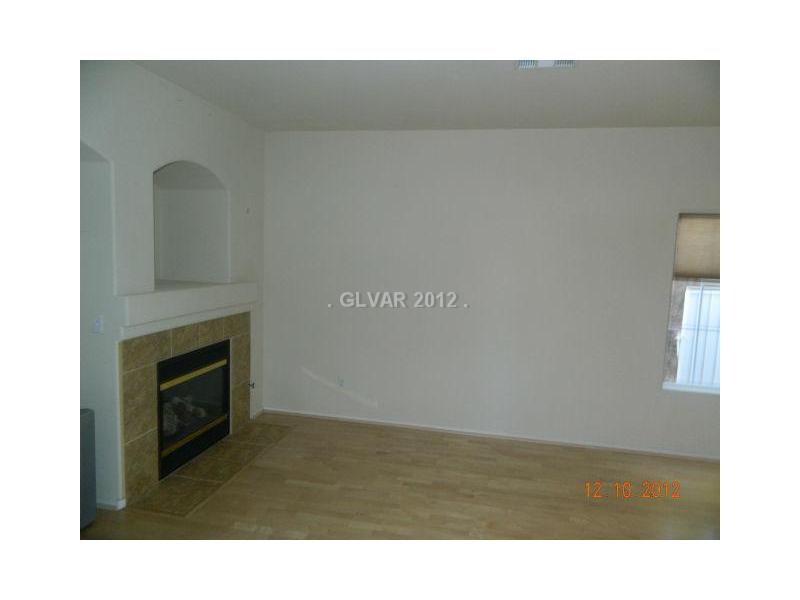 205 Heiple Court Henderson, NV 89052 - Photo 5 of 35 Living Room. FIREPLACE IN THE LIVING ROOM