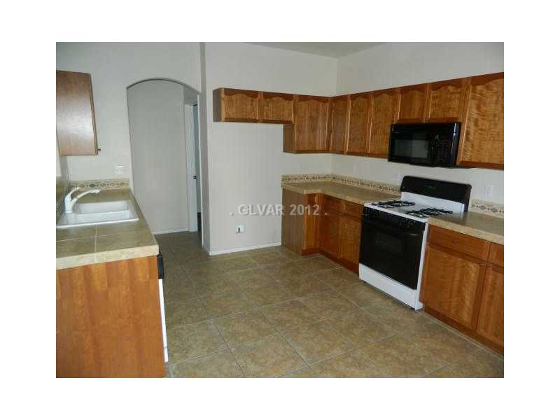 205 Heiple Court Henderson, NV 89052 - Photo 7 of 35 Kitchen. CUSTOM TILE ACCENTS IN THE KITCHEN