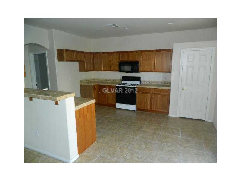 205 Heiple Court Henderson, NV 89052 - Photo 9 of 35 Dining Room. OPEN DINING AREA OFF THE KITCHEN AND BREAKFAST BAR