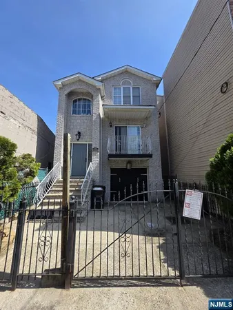 a front view of a house with balcony