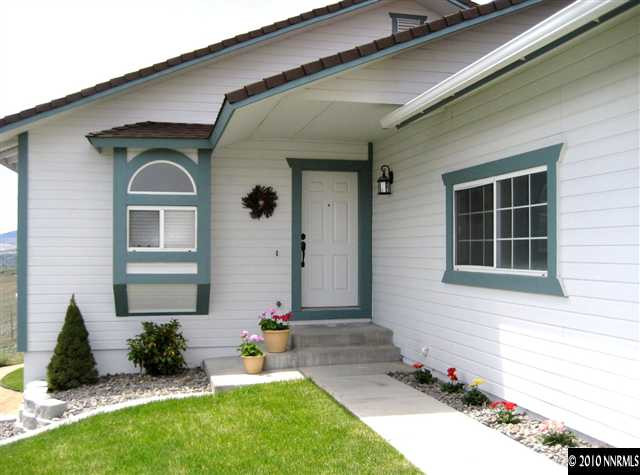 690 Tarn Way Reno, NV 89503 - Photo 3 of 13 a front view of a house with a yard
