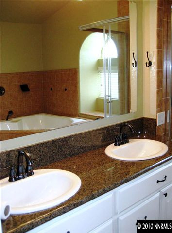 690 Tarn Way Reno, NV 89503 - Photo 9 of 13 a bathroom with a sink and a mirror