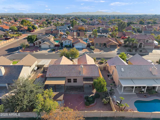 a view of a room with a window and ceiling fan