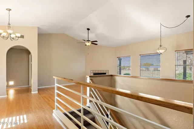 a view of a kitchen with a sink and a window