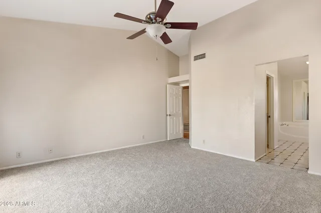 a kitchen with stainless steel appliances granite countertop a refrigerator a sink dishwasher and a refrigerator with wooden floor