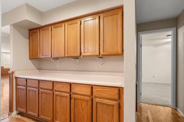 a view of an empty room with a ceiling fan