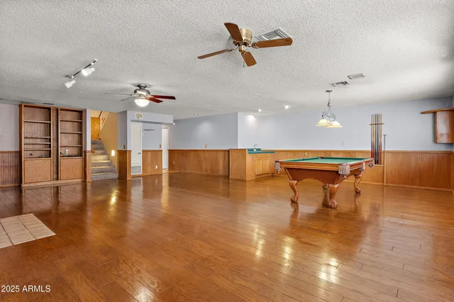 a picture of a bench in front of a wall