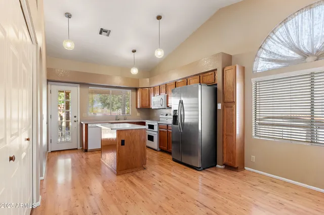 a view of a living room and a balcony