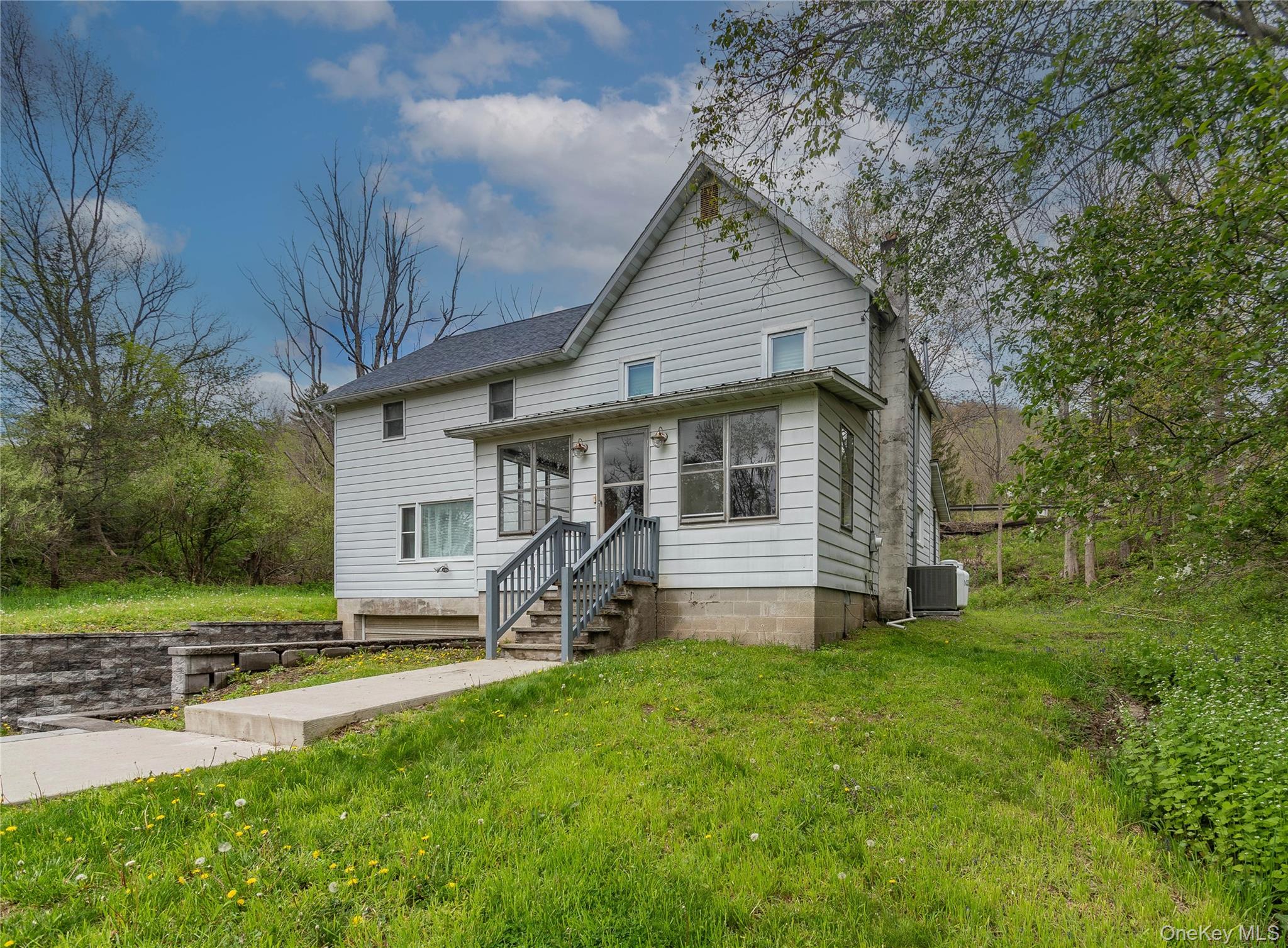 189 Church Street Hancock, NY 13783 - Photo 2 of 47 a view of a house with a yard and sitting area