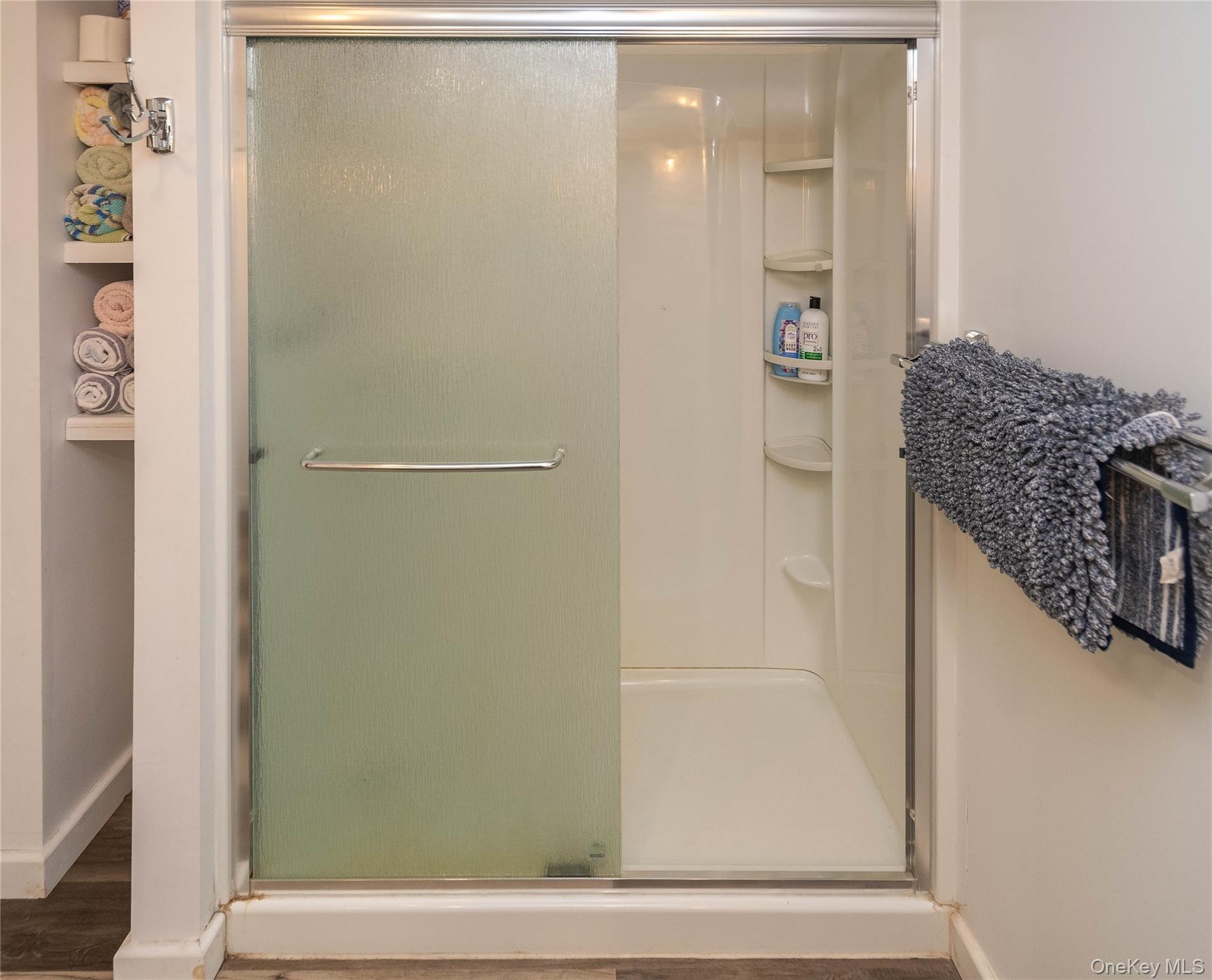 189 Church Street Hancock, NY 13783 - Photo 21 of 47 a bathroom with a granite countertop shower and a sink
