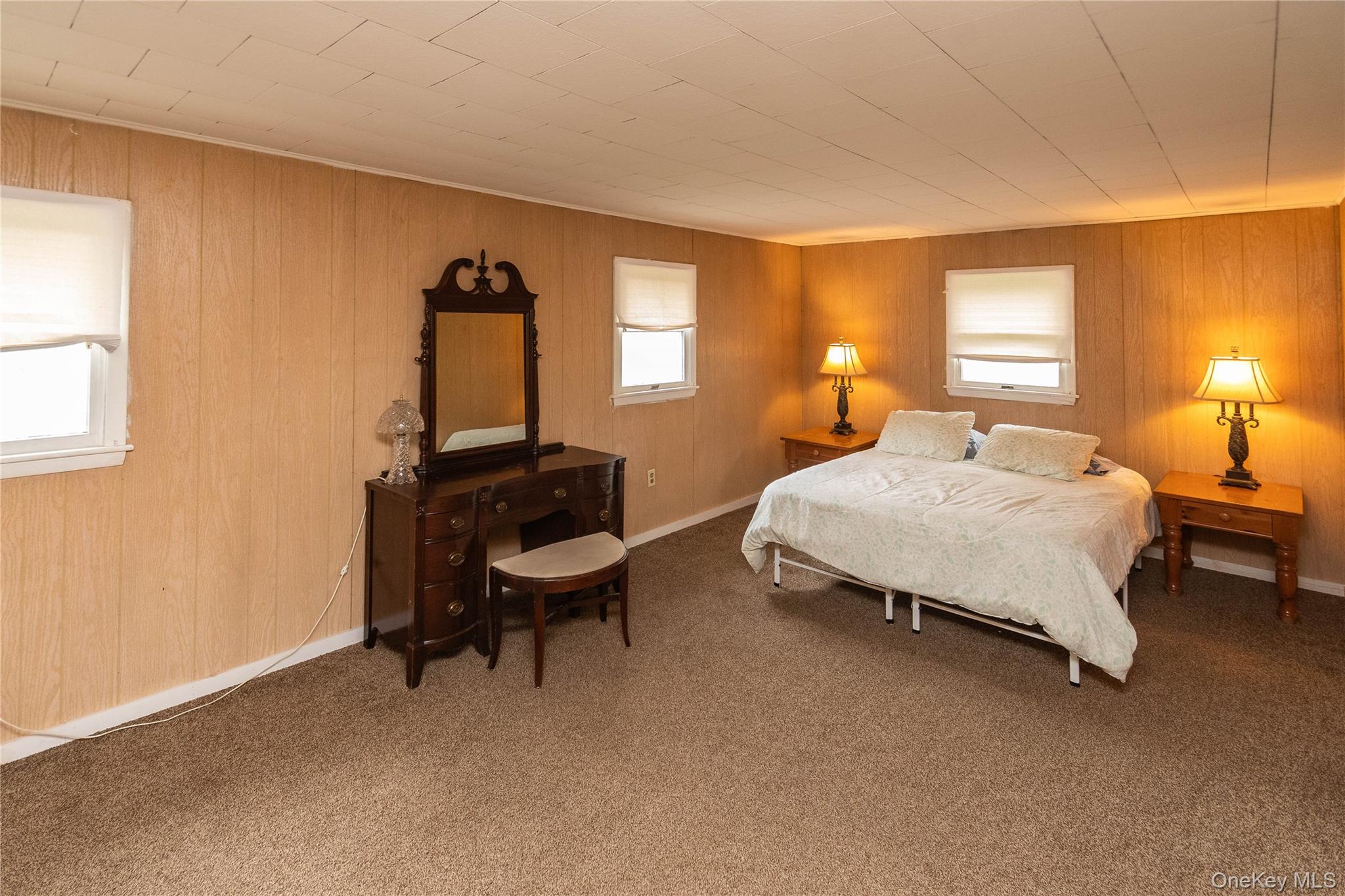 189 Church Street Hancock, NY 13783 - Photo 25 of 47 a bedroom with a bed chair and a window