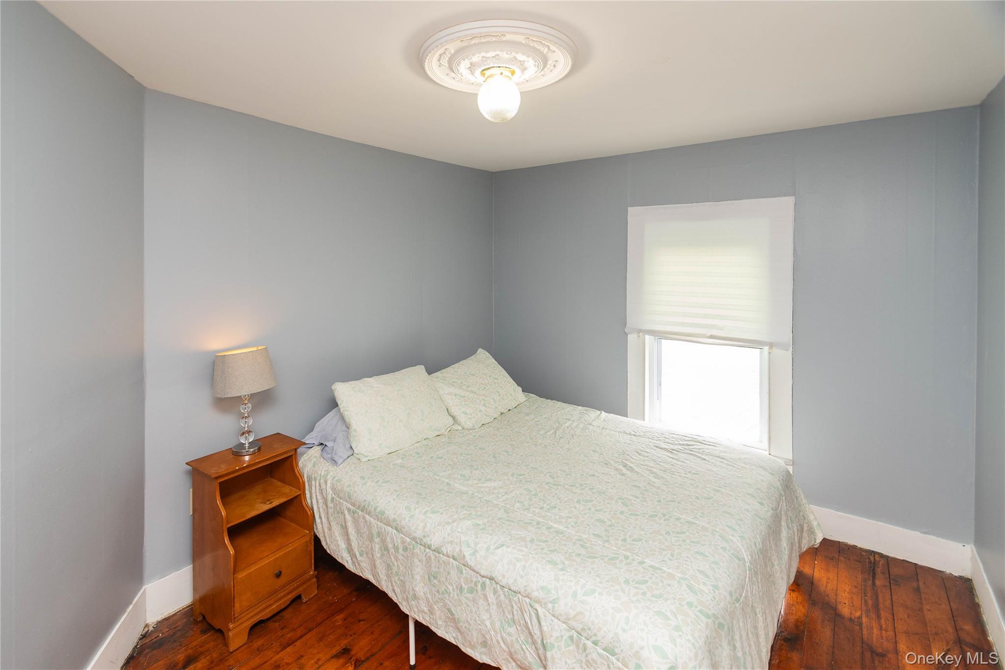 189 Church Street Hancock, NY 13783 - Photo 28 of 47 a bedroom with a bed and a window