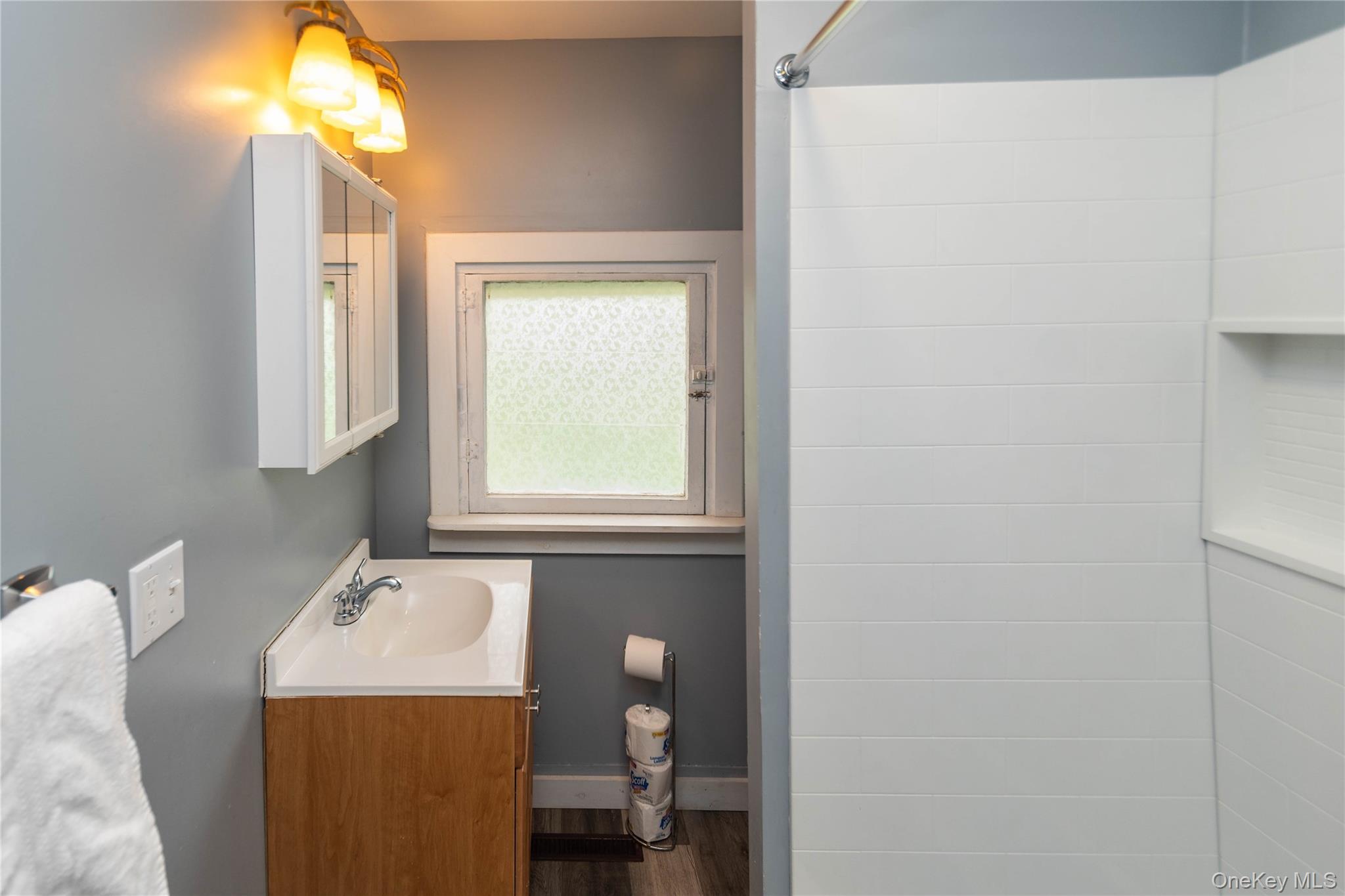 189 Church Street Hancock, NY 13783 - Photo 35 of 47 a bathroom with a sink and a mirror