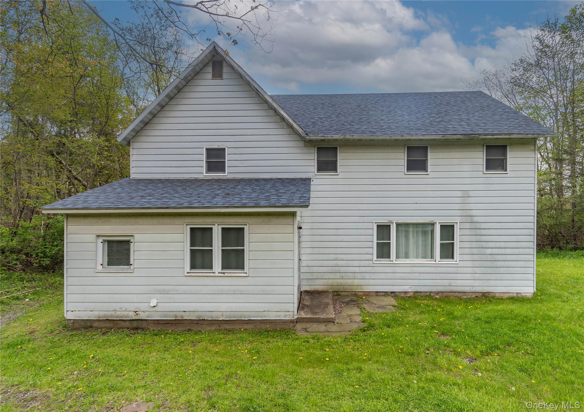 189 Church Street Hancock, NY 13783 - Photo 7 of 47 a front view of a house with a garden