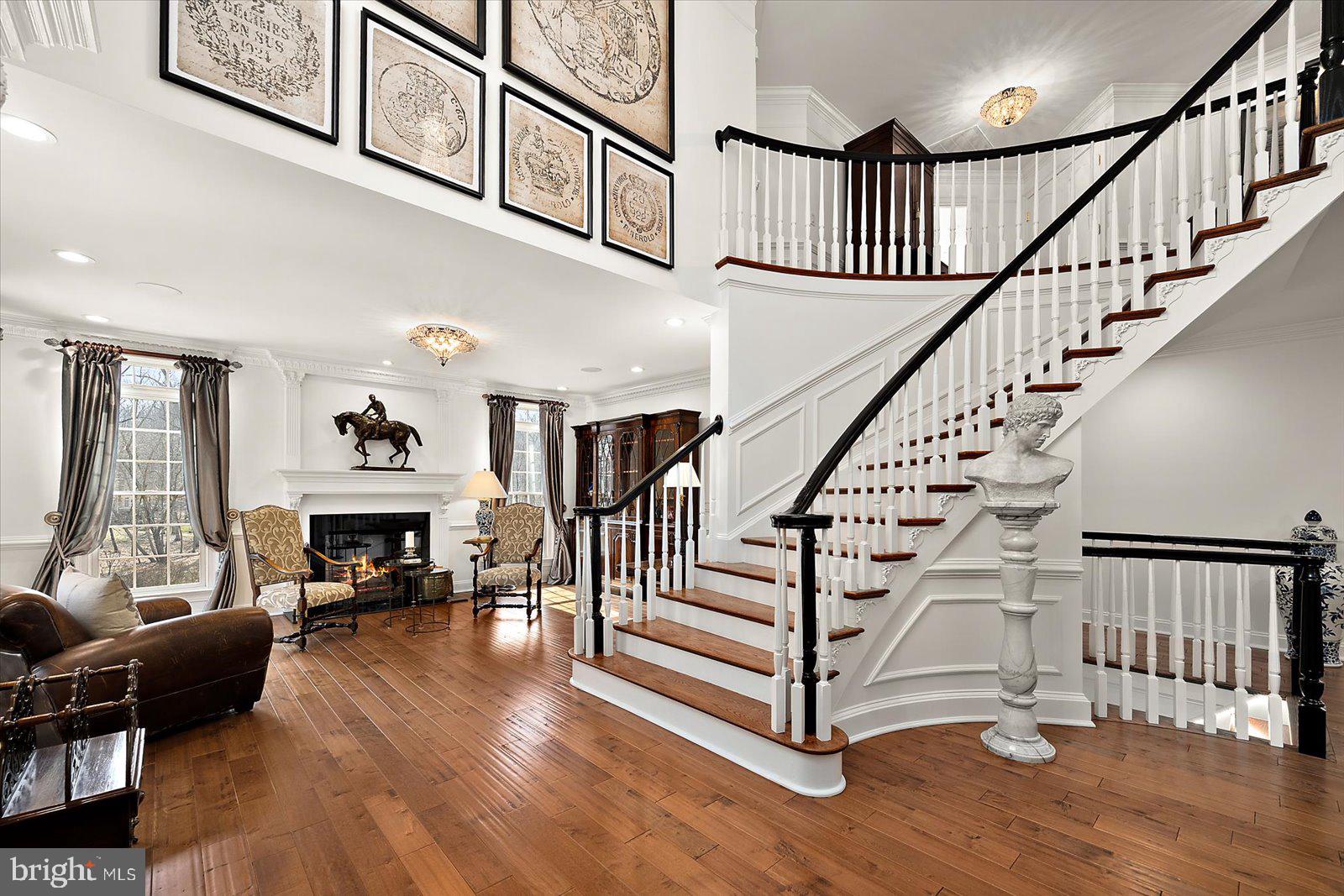 17 Perder Lane Edgewater, MD 21037 - Photo 41 of 115 Curved stairwell with wide hardwood steps