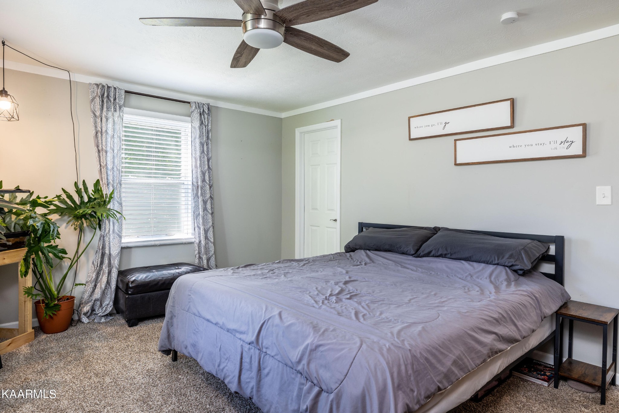 117 Jarrett Lane Oak Ridge, TN 37830 - Photo 17 of 35 a bedroom with a bed and a potted plant