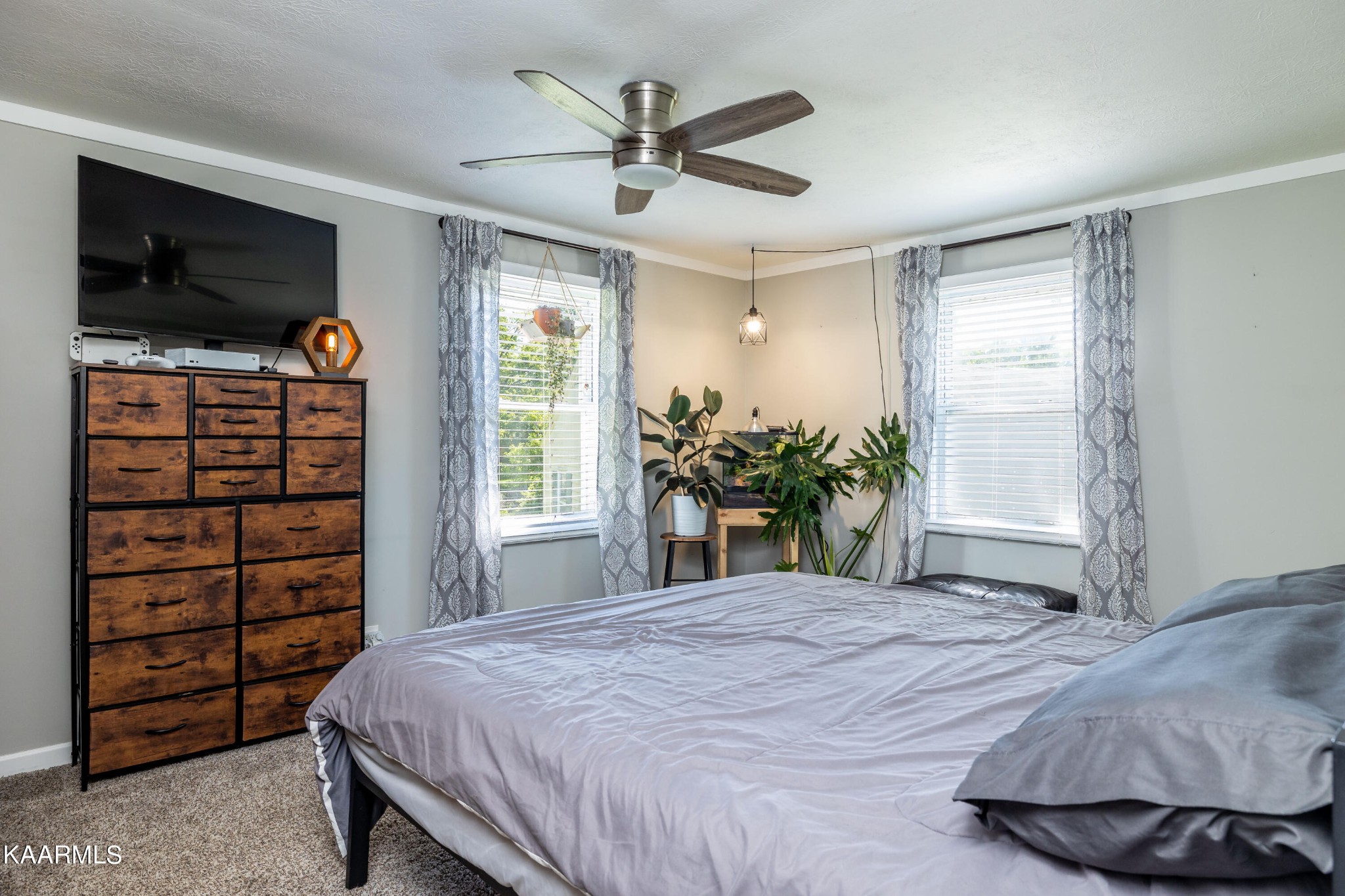117 Jarrett Lane Oak Ridge, TN 37830 - Photo 18 of 35 a bedroom with a bed and a flat tv screen on dresser