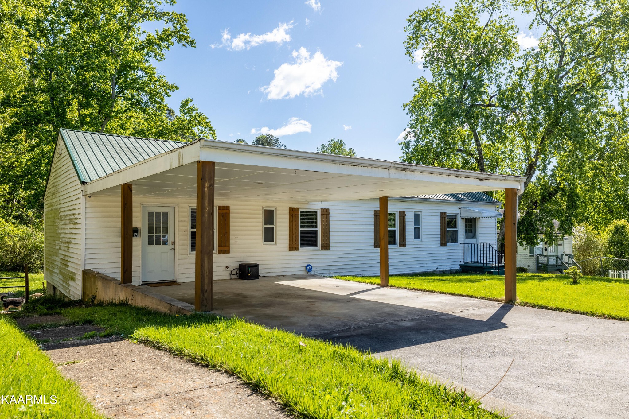 117 Jarrett Lane Oak Ridge, TN 37830 - Photo 3 of 35 a view of a house with a swimming pool and a yard