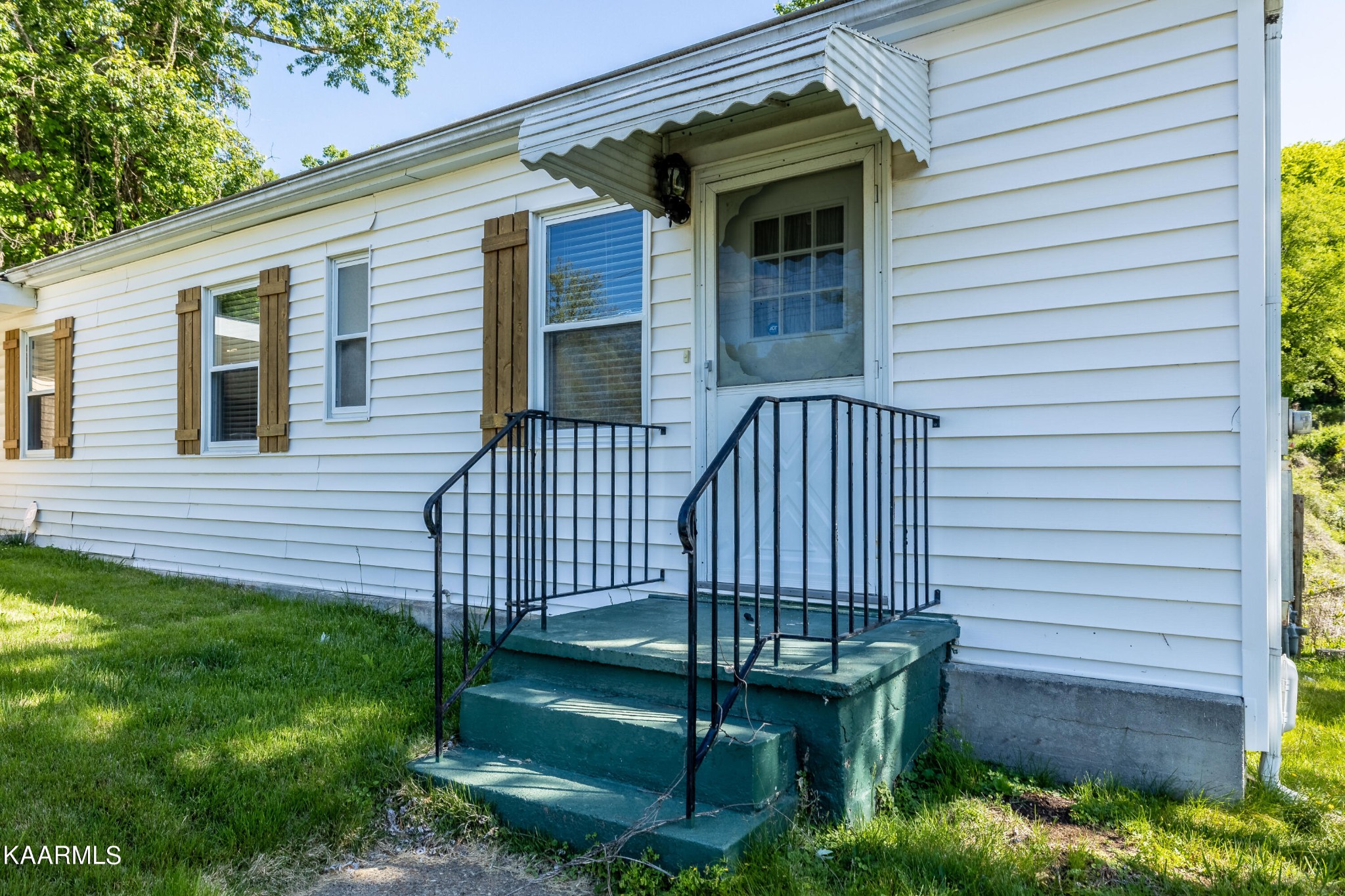 117 Jarrett Lane Oak Ridge, TN 37830 - Photo 5 of 35 a view of a house with a backyard