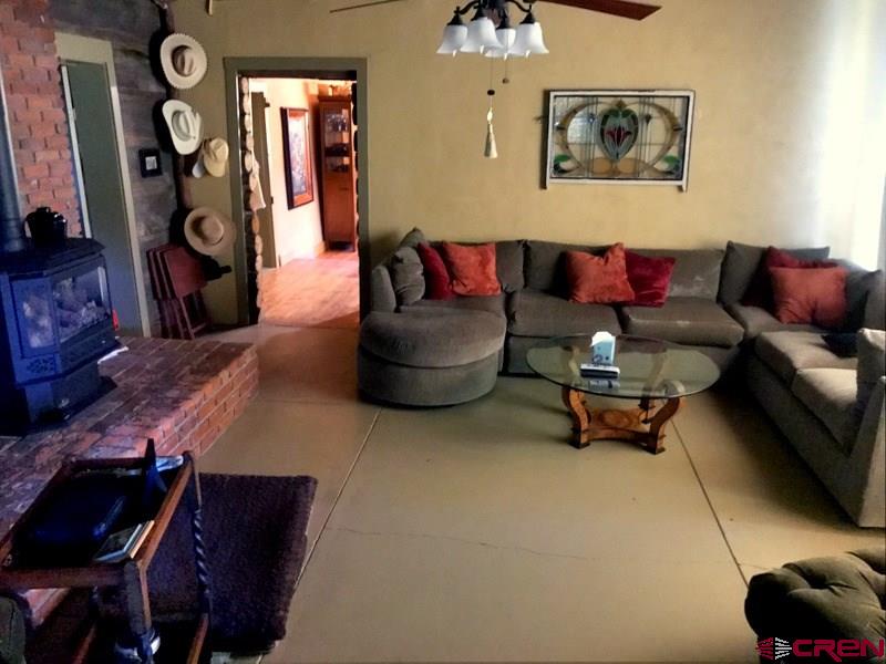 Tbd Shaw Creek Ranch Road Del Norte, CO 81132 - Photo 12 of 35 a living room with furniture and a mirror