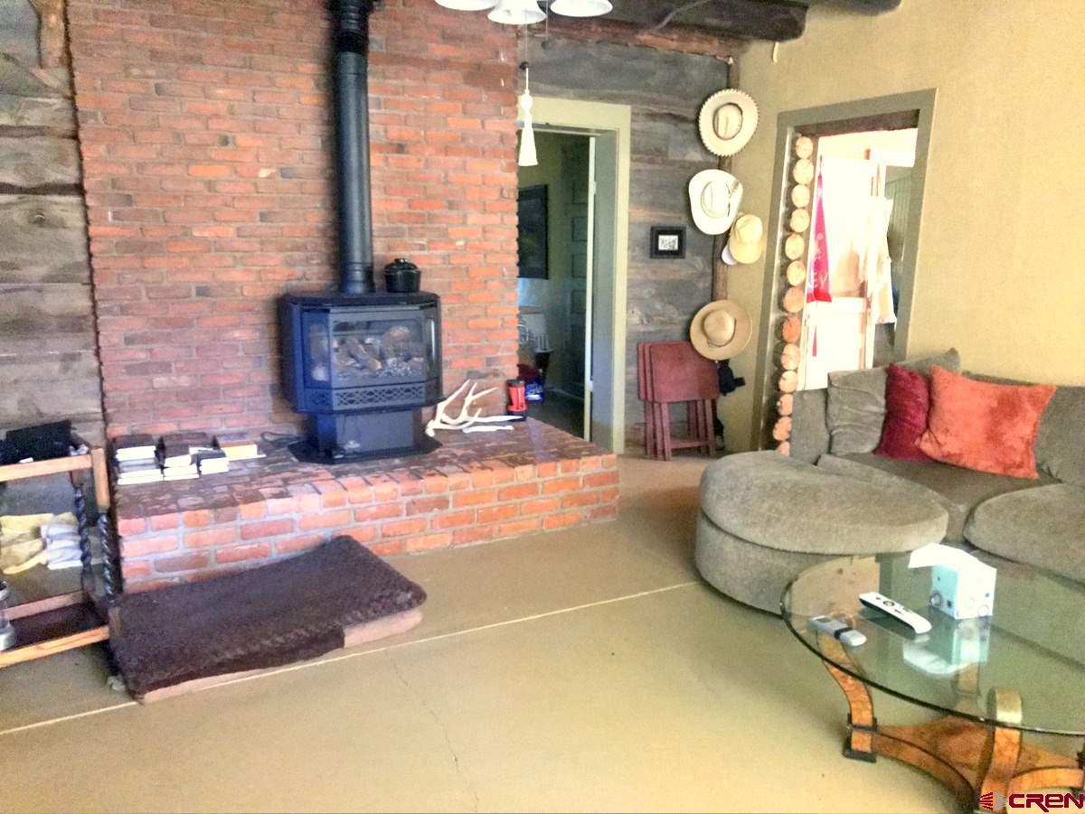 Tbd Shaw Creek Ranch Road Del Norte, CO 81132 - Photo 13 of 35 a living room with furniture and wooden floor