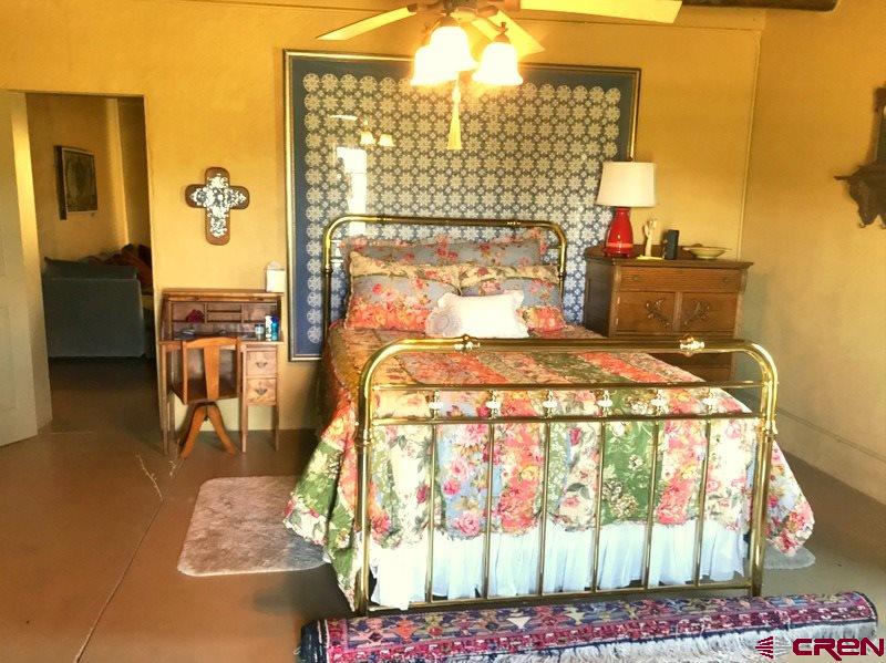 Tbd Shaw Creek Ranch Road Del Norte, CO 81132 - Photo 16 of 35 a bedroom with a bed and balcony view