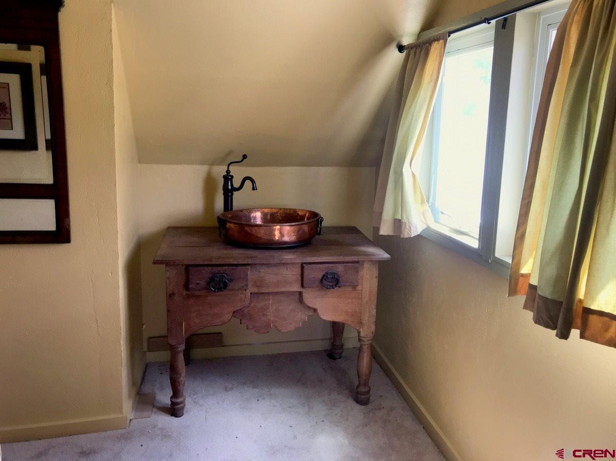 Tbd Shaw Creek Ranch Road Del Norte, CO 81132 - Photo 17 of 35 a dining room with furniture and a window