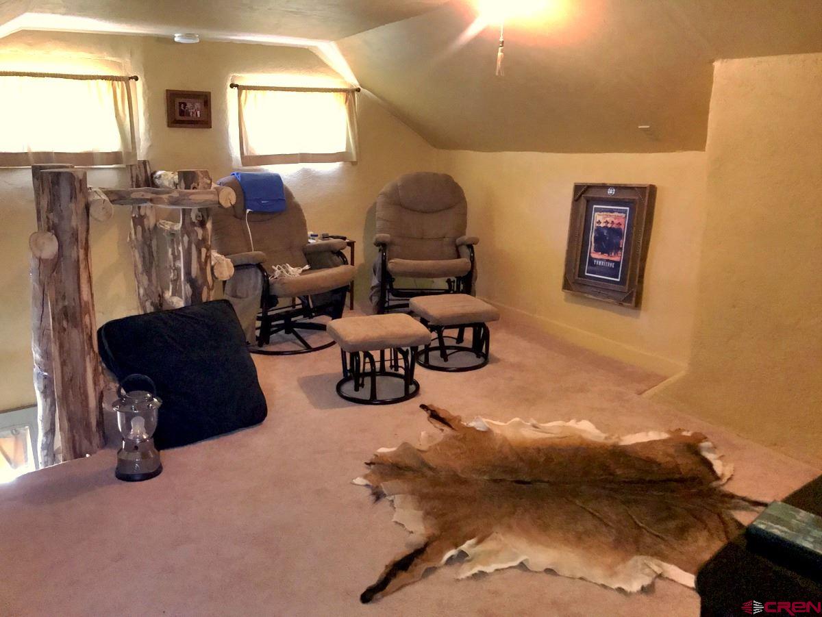 Tbd Shaw Creek Ranch Road Del Norte, CO 81132 - Photo 18 of 35 a living room with furniture and a window