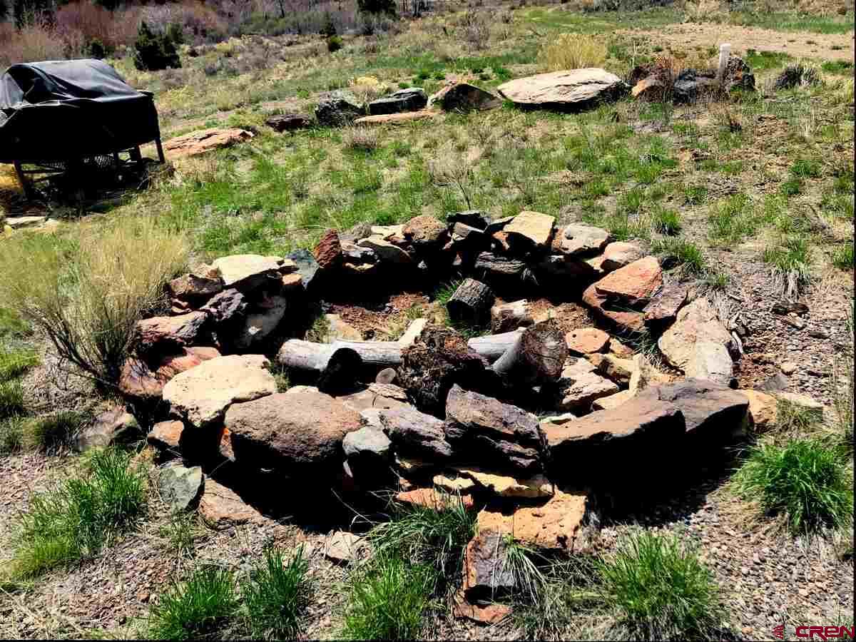 Tbd Shaw Creek Ranch Road Del Norte, CO 81132 - Photo 23 of 35 an aerial view of a house with a yard and large trees