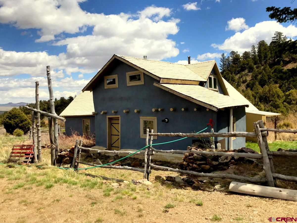 Tbd Shaw Creek Ranch Road Del Norte, CO 81132 - Photo 4 of 35 a view of a house with yard and sitting area