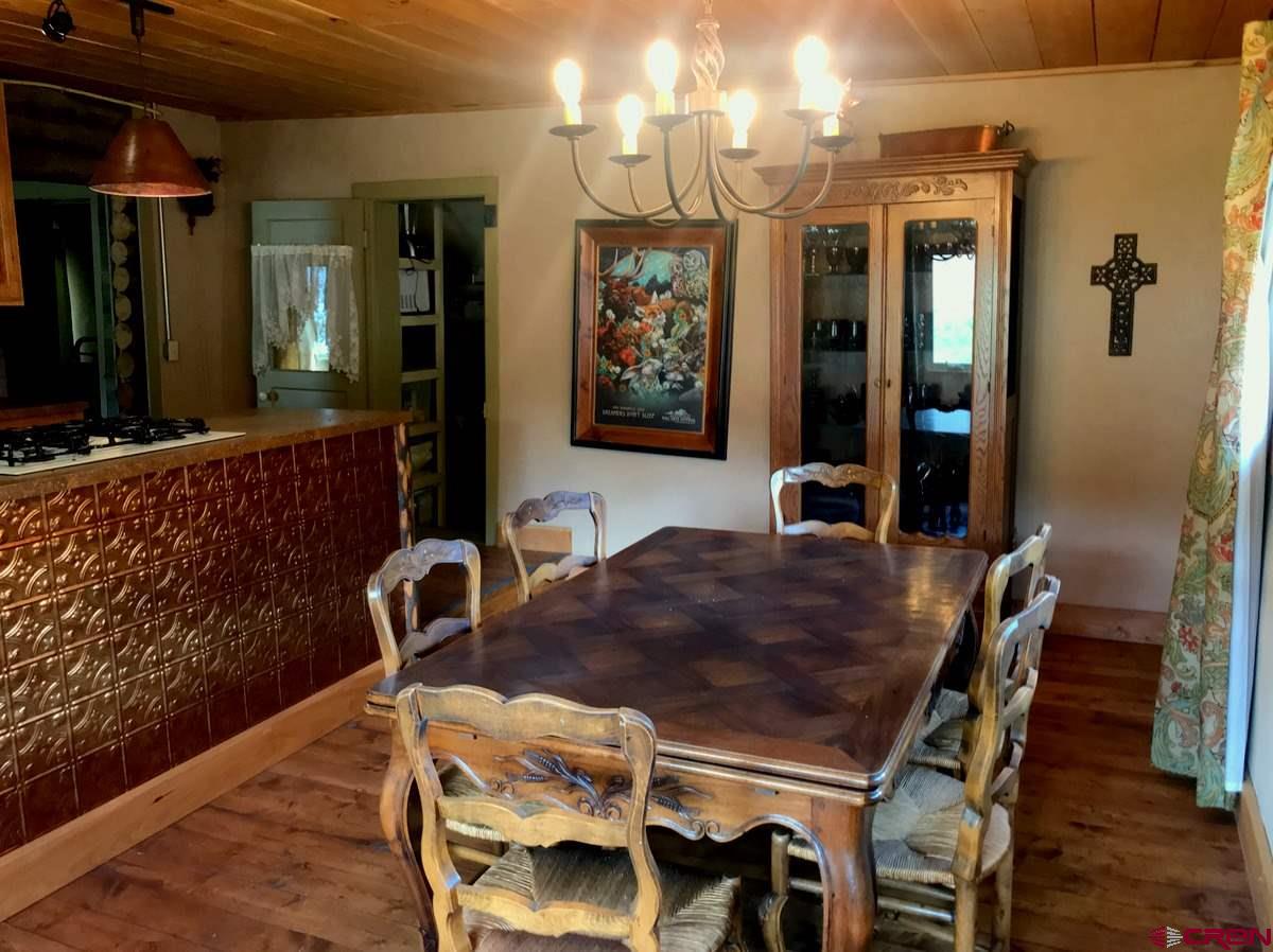 Tbd Shaw Creek Ranch Road Del Norte, CO 81132 - Photo 6 of 35 a dining room with furniture and window