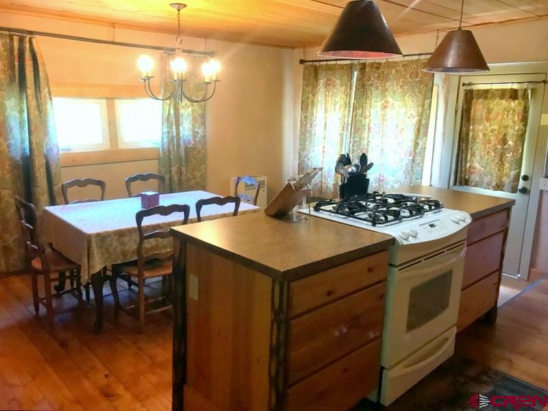 Tbd Shaw Creek Ranch Road Del Norte, CO 81132 - Photo 9 of 35 a kitchen that has a lot of cabinets and a stove