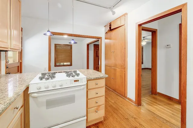 a bathroom with a sink vanity and a mirror