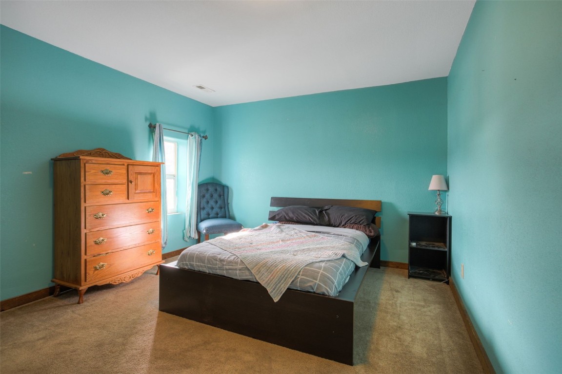 73 Mid Land Avenue Hartsel, CO 80449 - Photo 14 of 31 a bedroom with a bed and a table