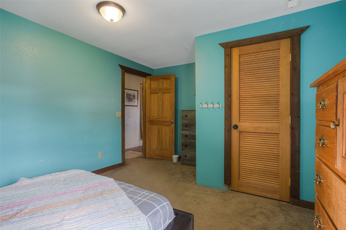 73 Mid Land Avenue Hartsel, CO 80449 - Photo 15 of 31 a bedroom with a bed and a table