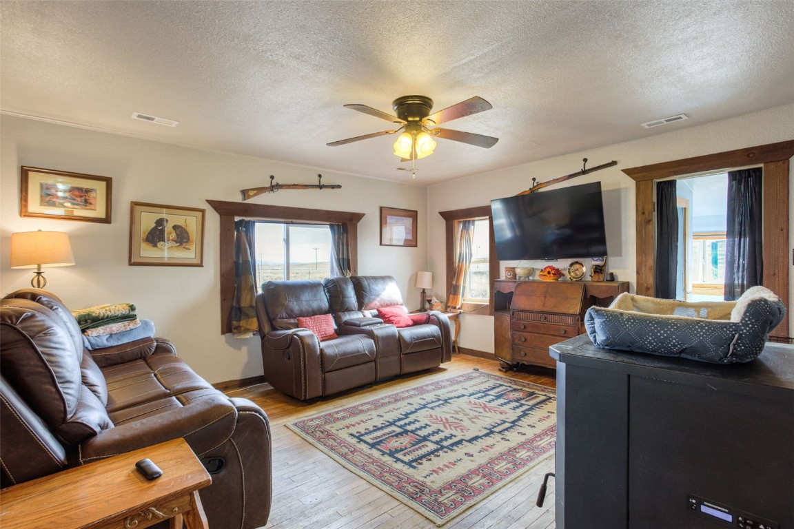 73 Mid Land Avenue Hartsel, CO 80449 - Photo 6 of 31 a living room with furniture and a flat screen tv