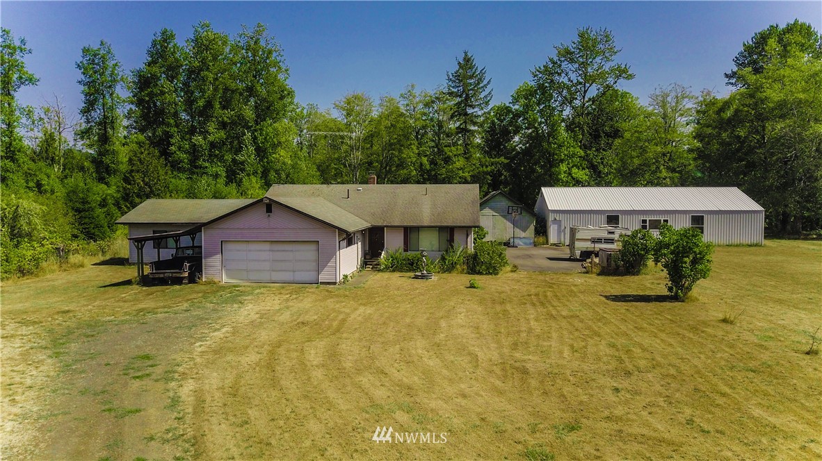 146 Mauerman Road North Chehalis, WA 98532 - Photo 1 of 40 a yellow house with trees in front of it