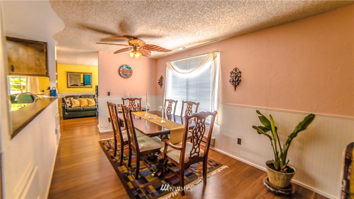 146 Mauerman Road North Chehalis, WA 98532 - Photo 16 of 40 a dining room with furniture and wooden floor