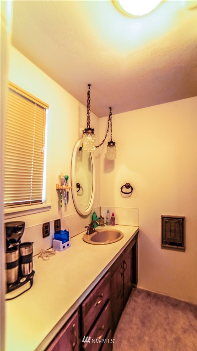 146 Mauerman Road North Chehalis, WA 98532 - Photo 24 of 40 a bathroom with a sink and a mirror