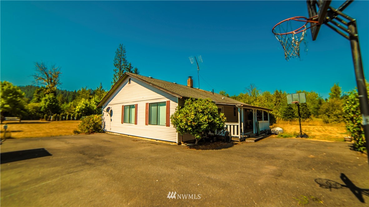 146 Mauerman Road North Chehalis, WA 98532 - Photo 35 of 40 a view of a house with a yard and potted plants