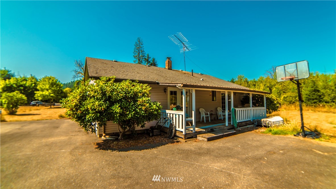 146 Mauerman Road North Chehalis, WA 98532 - Photo 36 of 40 a view of a house with backyard and sitting area