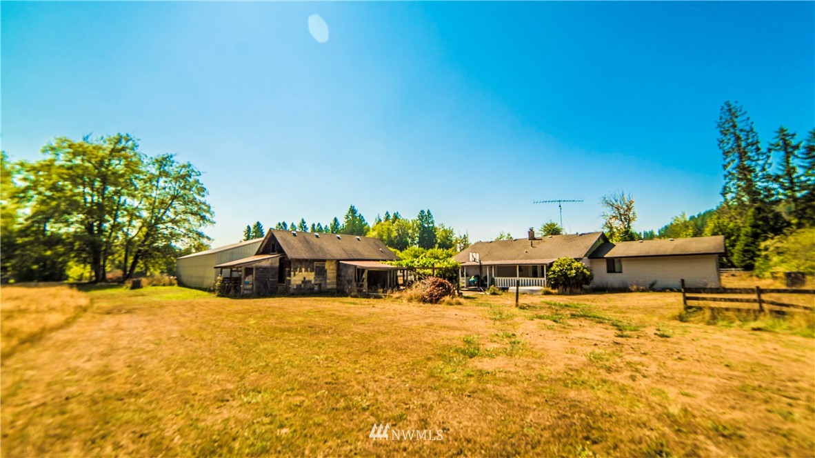 146 Mauerman Road North Chehalis, WA 98532 - Photo 40 of 40 a view of a swimming pool with an outdoor seating and a yard