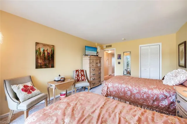 a bedroom with a bed and dresser