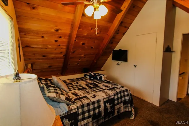 a bedroom with a bed and a table