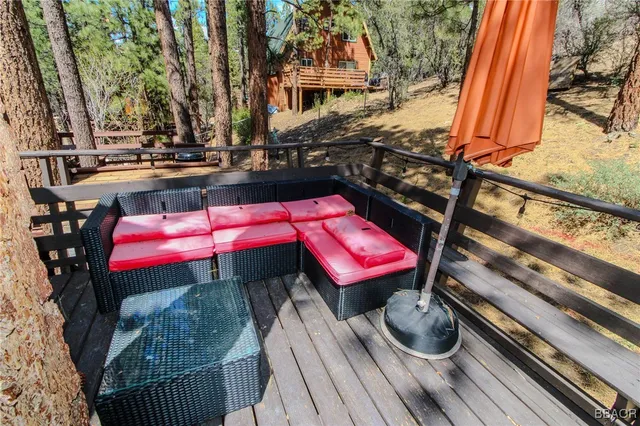 a view of a chairs and table in the balcony