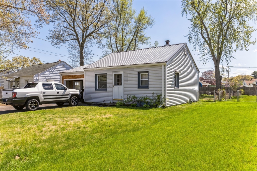 394 James Street Chicopee, MA 01020 - Photo 2 of 15 a view of a house with a patio