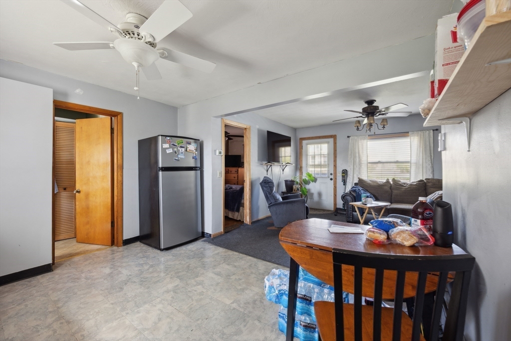 394 James Street Chicopee, MA 01020 - Photo 5 of 15 a view of a dining room with furniture and a chandelier fan
