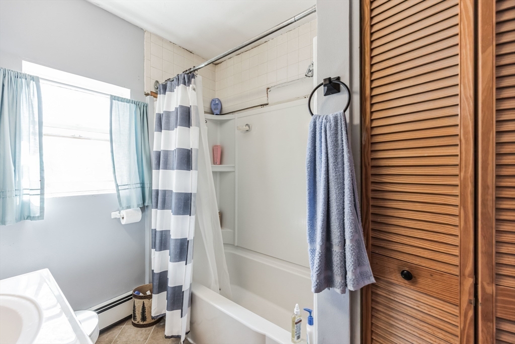 394 James Street Chicopee, MA 01020 - Photo 10 of 15 a bathroom with a shower and a sink