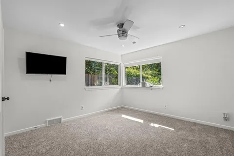 a view of a livingroom with a flat screen tv