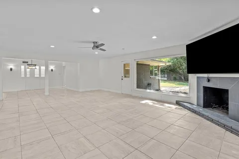 a view of an empty room with a fireplace